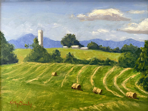 Landscape painting of a green field with haybales, a farm in the background and blue mountains in the distance against a blue sky by Kathy Chumley - Cottage Curator - Sperryville VA Art Gallery