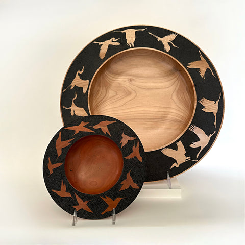 Pair of wood-turned plates with black rims and bird silhouette cutouts by Steve Schwartz at Nature's Studio Art Gallery - Front Royal VA