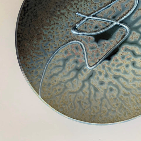 Detail of Stoneware wall platter with brown, blue, tan and gray glazing and raised spiral design by Richard Aerni at Cottage Curator - Sperryville VA Art Gallery