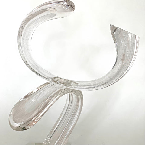 Detail of Clear blown-glass sculpture featuring three curves balanced on a square base by Neil Duman at Cottage Curator - Sperryville VA Art Gallery