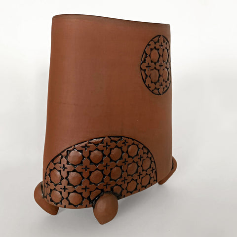 Stoneware vessel in natural tan clay color with carved patterned circles and three feet by Yoshi Fujii at Cottage Curator - Sperryville VA Art Gallery