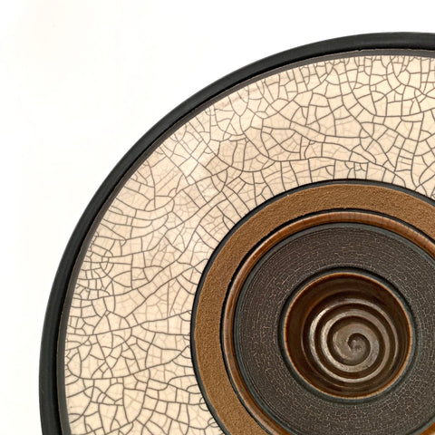 Detail of raku fired ceramic art piece with varying rings of neutral glaze by Sheldon Ganstrom at Cottage Curator - Sperryville VA Art Gallery