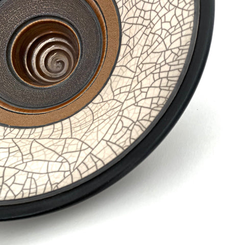 Detail of raku fired ceramic art piece with varying rings of neutral glaze by Sheldon Ganstrom at Cottage Curator - Sperryville VA Art Gallery