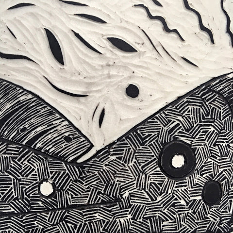 Detail of carving on clay vase in black and white by Shirley Gromen