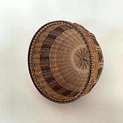 Round woven basket made of white oak in natural and brown patter by Leon Niehues at Cottage Curator - Sperryville VA Art Gallery