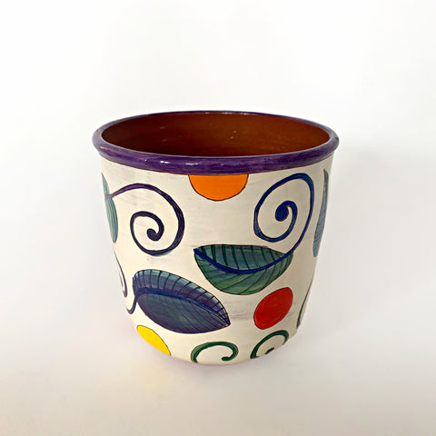 Ceramic pot with green, blue and purple plants and multi-colored polka dots with clay interior by Sara Schneidman at Cottage Curator - Sperryville VA Art Gallery